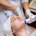 young beautiful girl lies beautician s table receives procedures 1290x750 1