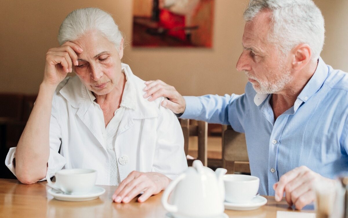 medium shot husband comforting upset wife 1