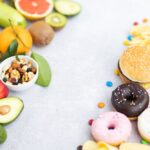 Side-by-side comparison of whole fruits, vegetables, and nuts on the left versus processed junk food on the right representing what to eat after Morpheus8 for better healing and collagen production