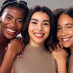 Three confident women with diverse skin tones after Morpheus8 for dark skin tones treatment