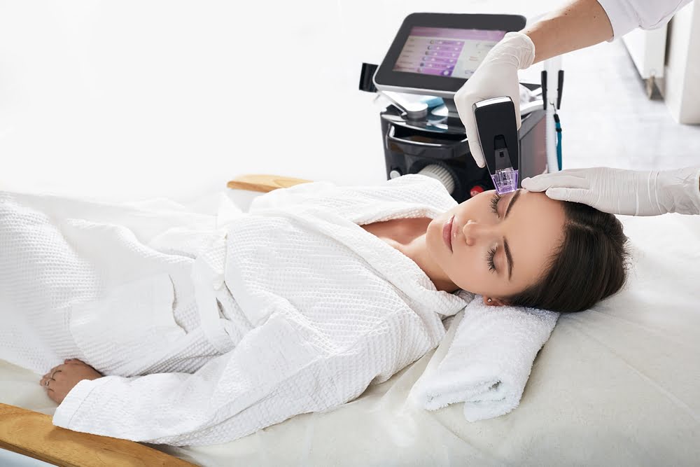 Morpheus8 Treatment in Grand Prairie TX applied to forehead at Medi-Elite Health & Wellness in Bedford TX
