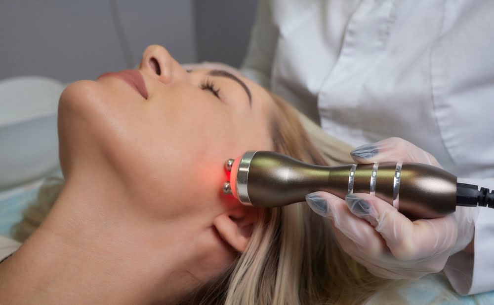 Provider performing Quantum RF treatment in Flower Mound TX targeting jaw and neck at Medi-Elite Health and Wellness Bedford office